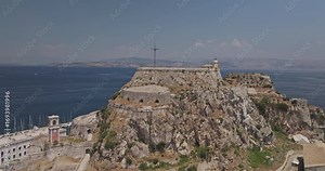 Corfu Greece Aerial v4 circling around the Old Fortress on the promontory capturing views of Garitsa Bay, marina harbor and island town center - Shot with Mavic 3 Pro Cine - July 16th 2024