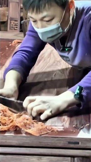 The Process Of Scraping Old Wood Table Top Using Manual Tools