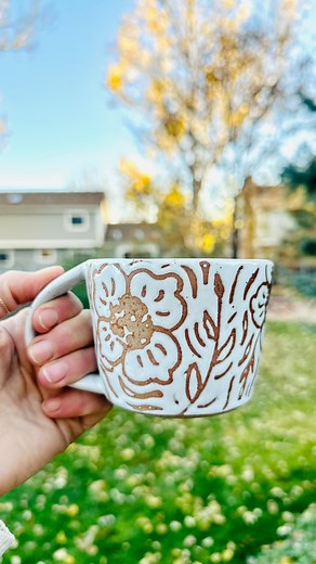 She is a beauty 😍 Wax resist floral mug #glazing #handmadepottery #glazingpottery #waxresist #pottery #ceramics #floralpottery #longmontcolorado #uniquemugs @wheelhouse_clay | Thefriendliestflower