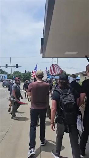 5.7K views · 79 reactions | A militia style group carrying shields emblazoned with "Patriot Front" are chased into the back of a lorry by attendees at 'Pridefest', a gay pride festival in Springfield, Missouri - June 14th, 2025 Humans Of Dystopia | Humans Of Dystopia | Facebook