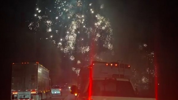 Fireworks explode over stopped highway after accident