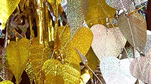 Traditional Buddhist decoration - golden and silver Bodhi Tree - Buddhist tree, Buddhist temple, The Vat Phramahathat Rajbovoravihane Luang Prabang, Laos.