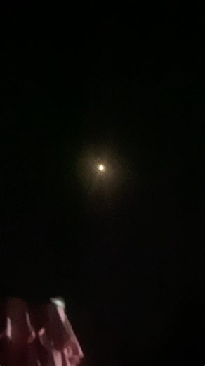 A Helicopter flying above super close at night