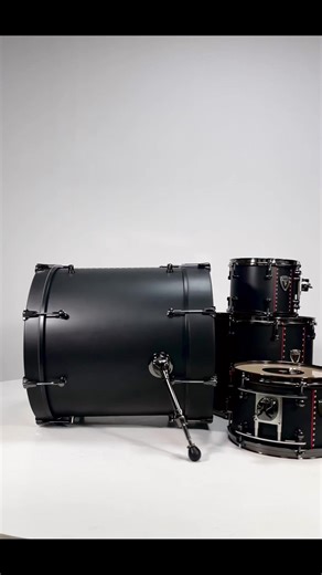 "Introducing the Morpheus Drum Kit: Where Elegance Meets Aggression! 🥁🔴Behold the epitome of musical style and power – the Morpheus Drum Kit. With its sleek matte black finish and striking red accents, this drum set is the embodiment of elegance and aggression. The moment you lay your hands on these drums, you'll feel the perfect harmony of sophistication and intensity. Get ready to unleash your inner rock star with Morpheus! 🎶🤘 #DrummingElegance #MorpheusKit #RockOn | Varus Drums