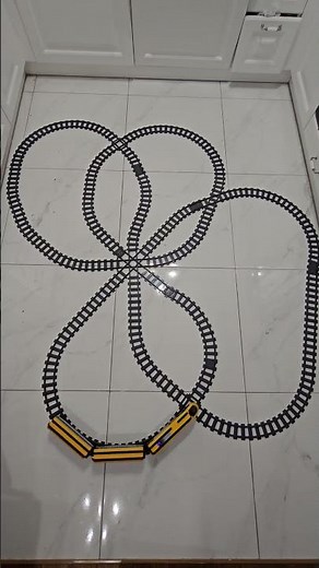 Endless LEGO train loop on kitchen tiles!