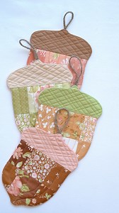 620K views · 13K reactions | Pretty patchwork acorns make an adorable garland to hang in your home! Leave a few aside to use as coasters and give your guests a sweet spot to set their pumpkin spice lattes. ☕️ Fabric: Cinnamon & Cream by @figtreeandco for @modafabrics Get the Acorn Garland or Coasters Kit now on our site! | Shabby Fabrics | Facebook