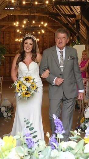 Bride walking up the aisle with her father
