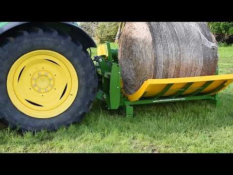 Watch Hustler's Patented Self-Loading Bale Feeder!