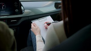 Free stock video - Woman writing notes