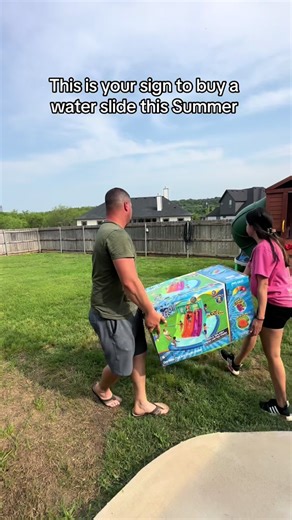 This is your sign to buy a water slide this Summer