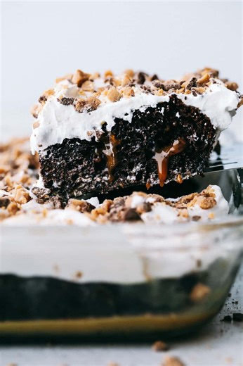 Recipe here: https://therecipecritic.com/better-than-sex-cake/ This better than anything cake is a chocolate cake filled with caramel pockets, layered with cool whip and topped with heath bites making this cake extremely moist and flavorful in every bite! | Tried and True Recipes