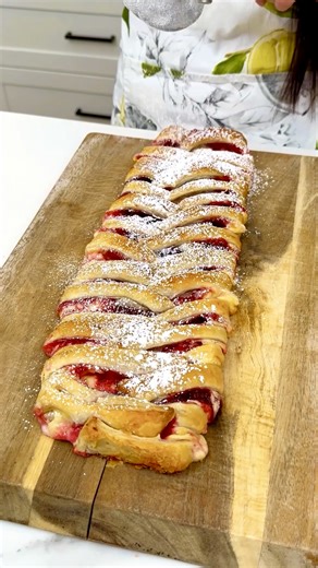 This dessert is my new favorite! I make a strawberry and cream cheese strudel with strawberry filling and sweetened cream cheese wrapped up in puff pastry. | Amy's Kitchen