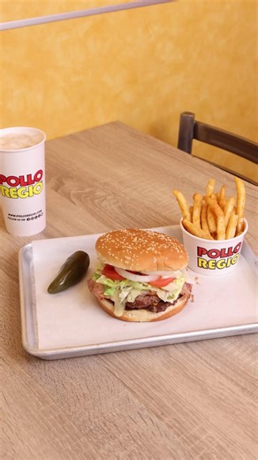 Every layer tells a story: juicy, cheesy, and full of flavor. 🍔 #PolloRegio #MexicanBurger | Pollo Regio