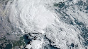 Bertha unloads tropical downpours over waterlogged Carolinas