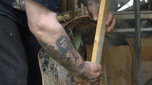 Conne River embracing birchbark canoe building