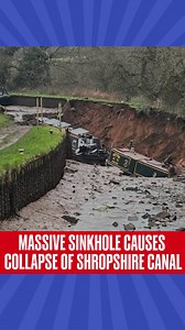 A section of the Shropshire Union Canal collapsed after a massive sinkhole opened beneath the embankment, draining the canal and leaving boats stranded in thick mud. Emergency services rescued more than 10 people as authorities declared a major incident and sealed off the area. Drone visuals showed a large crater where the canal once flowed, with repairs expected to take months, disrupting a key leisure boating route in the UK. #shropshireunioncanal | #sinkhole |#collapse | #unitedkingdom | #Rep
