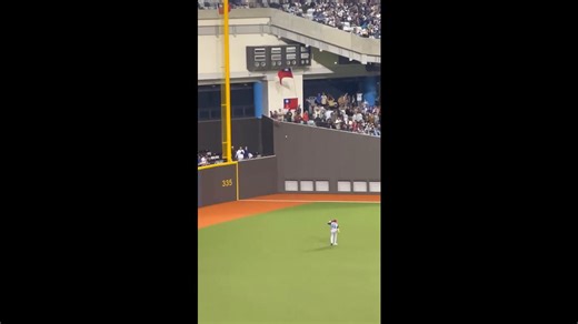 Baseball player plays with fan during game break