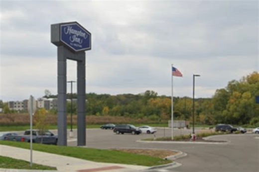 Crane removes Hampton Inn Hilton sign at hotel accused of denying entry to ICE agents