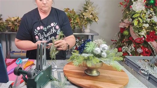 Tonight, Coach Julie is showing us how to make a beautiful DIY Hanukkah Silk Flower Table Arrangement. We love the silver and blues used in this, which are perfect for the season. What do y'all think?? | Southern Charm Wreaths