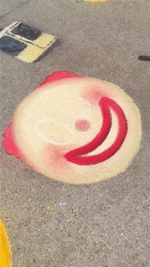 Attempting to Chalk the Clown Emoji Before the Rain Comes 🤡