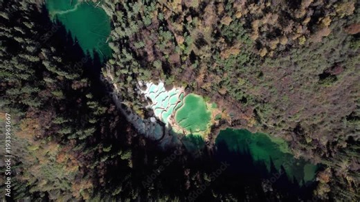 Drone view of Shenxianchi Scenic Area in Sichuan, China, near Jiuzhaigou and Huanglong, peaceful and clean water in pond among mountains, 4k real time footage travel concept.
