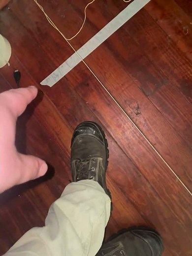 Setting up a string level before jacking the floor joist.