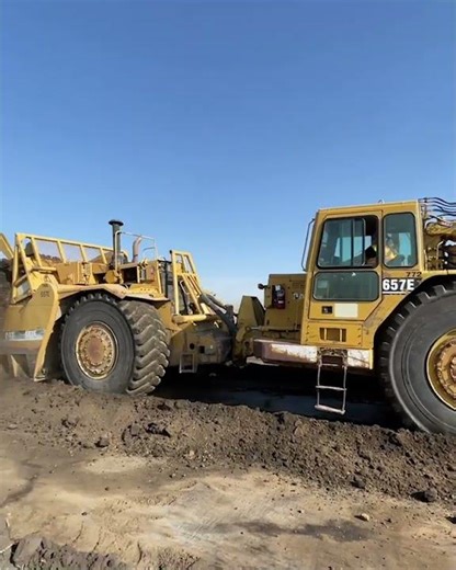 657 scraper in push pull formation scooping up 88 cubes of earth in ~45 seconds