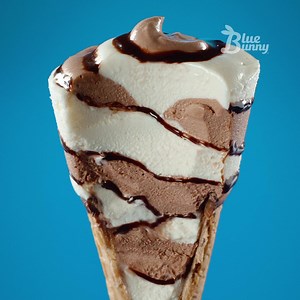 859K views · 1.9K reactions | Treat your tastebuds to creamy chocolate, soft vanilla, and ooey gooey fudge swirls all twisted up in a crunchy sugar cone. | Blue Bunny | Facebook