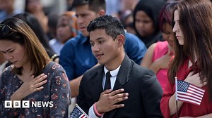 What must Americans do during the anthem?