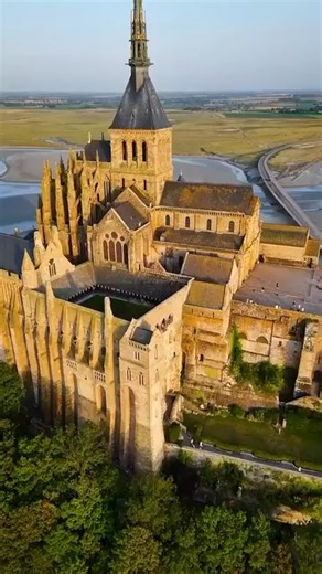 🛕Mont-Saint-Michel Abbey, an ancient monastery located on a small rocky island in Normandy, France. The abbey was built in 709 and is a masterpiece of medieval architecture. The island is connected to the mainland by a natural causeway, which is only visible at low tide. 📸Awesome video by: @ken4photo | Beautiful Houses and Buildings