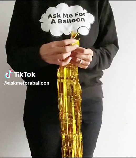 Do this with foil fringe curtains and add to balloon columns! I folded the curtain twice, wrapped elastc band around top, tie band, cut looped ends & add to decor. Follow me for tutorials, tips & inspiration 🎈#balloons #balloonsoftiktok #balloonartist #balloonartistsoftiktok #foilfringecurtain #diyparty #balloondecor #partydecorationideas #askmeforaballoon