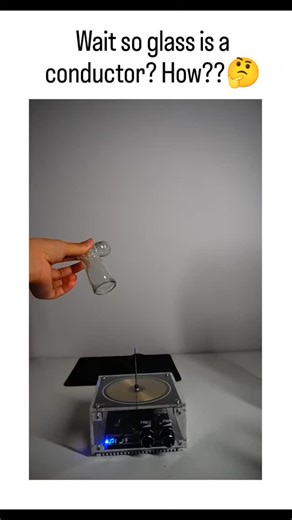 @crazy_trends08 on Instagram: "The post showcases a viral video (8M views) of a plasma globe, where a hand touching the insulating glass attracts purple plasma filaments, prompting surprise at apparent conductivity. Glass insulates direct current but permits capacitive coupling in high-frequency AC fields, enabling the external touch to guide ionized gas paths without actual electron flow through the glass, per University of Wisconsin physics explanations. Replies clarify this as a classic demo 