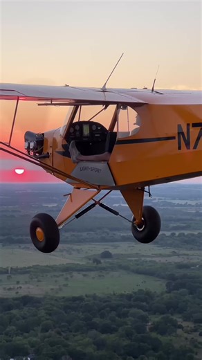 Breathtaking Sunset Flight in a Yellow Biplane