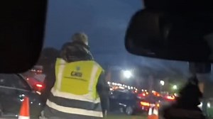 Cheeky music fan skips queue by changing into a hi-vis jacket