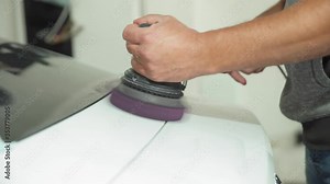 repair of the car body by polishing with a grinder. with the application of wax and paint protection