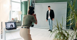 Photography, man and cameraman shooting fashion model in studio for creative, capture and image. Media agency, backstage or professional photographer with pictures, equipment or style for photoshoot