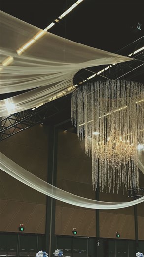 Lush Lighting on Instagram: "When you choose a large venue with high ceilings, it’s a dream space ,but it needs to be filled. An empty ceiling can make even the most beautiful wedding feel unfinished. That’s why ceiling décor isn’t “extra” ,it’s essential. Draping, chandeliers, soft fabrics and lighting create that feeling of celebration, warmth and magic. In big halls, the ceiling becomes the heart of the design. Once you dress it, the whole room transforms from a simple space into a truly unfo