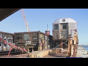 Retired NYC subway cars on the way to recycling plant