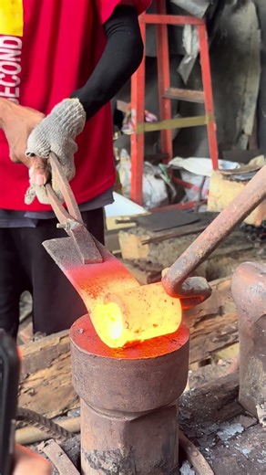 I opened an old coil spring manually using traditional blacksmith techniques.No machine