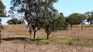Windmill and solar panels, rural outback Queensland Australia, farm farming power energy wind water pump, agriculture agricultural livestock