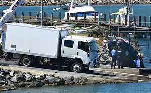 A woman is dead and a man is missing after a car plunged into the harbour in Bunbury.