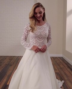 PAIGE • Semi-sheer drop waist bodice and long sleeve gown, delicate beaded neckline trim, sheer illusion back bodice with buttons, full A-line soft organza skirt, chapel train. Separate front bodice lining included. • Colours: Diamond White Sizes: 0-26 • Pm us for more details or to make an appointment懶 | Bibbidi Bobbidi Boo Bridal Boutique | Facebook