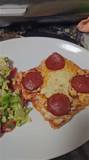 Keto Pizza with chorizo salami and side salad