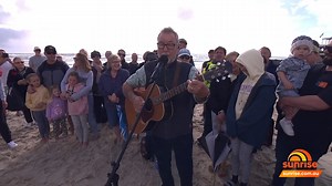 A special tradition each year is to hear John Williamson perform a live rendition of 'True Blue' live on the beach at Currumbin. Made more special this year as the iconic anthem celebrates 40 years. Don't miss John performing live around the country - more info: https://7news.link/3OKljDs | Sunrise