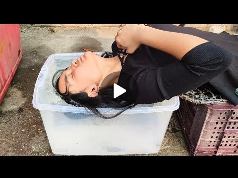Hair deep dunking underwater in transparent container