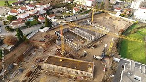 Construction cranes with new buildings under construction. Construction. Development of building architecture.