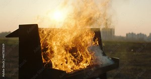 In the frame, a piano burning with bright flames. piano on fire. Piano on fire, slow motion. The fire from the piano. The art concept scene. Stock Video