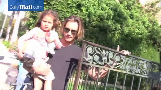 Gabriel Aubry carries daughter Nahla on his hip back in 2012