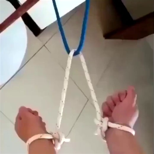 Topology in its purest form: seemingly inescapable knots around wrists, cables, and legs dissolve through a single continuous deformation.Just the quiet power of knot theory proving our 3D intuition is often a liar.