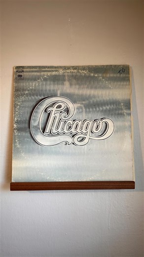 Vinyl Deep Dive on Instagram: "Chicago – Chicago II (1970) • Released in January 1970, Chicago II was the band’s second album and the one that launched them into mainstream success. Still performing under the name Chicago Transit Authority at the time of recording, the group delivered a bold double LP packed with jazz rock fusion, political themes, and horn driven power. • Key Tracks “25 or 6 to 4” Their first Top 5 hit, a guitar driven classic written by Robert Lamm and powered by Terry Kath’s 